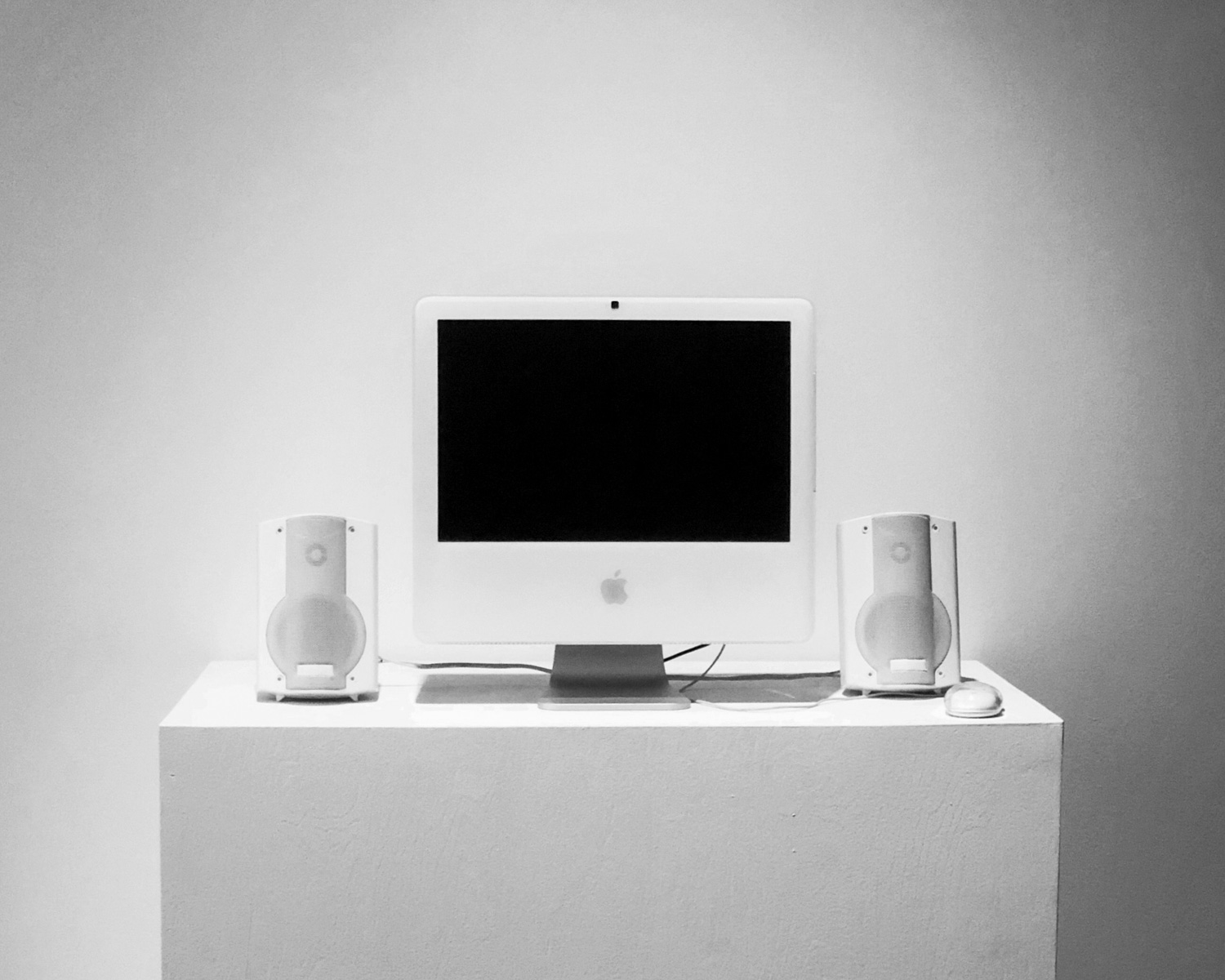 Apple Studio Display monitor on white table