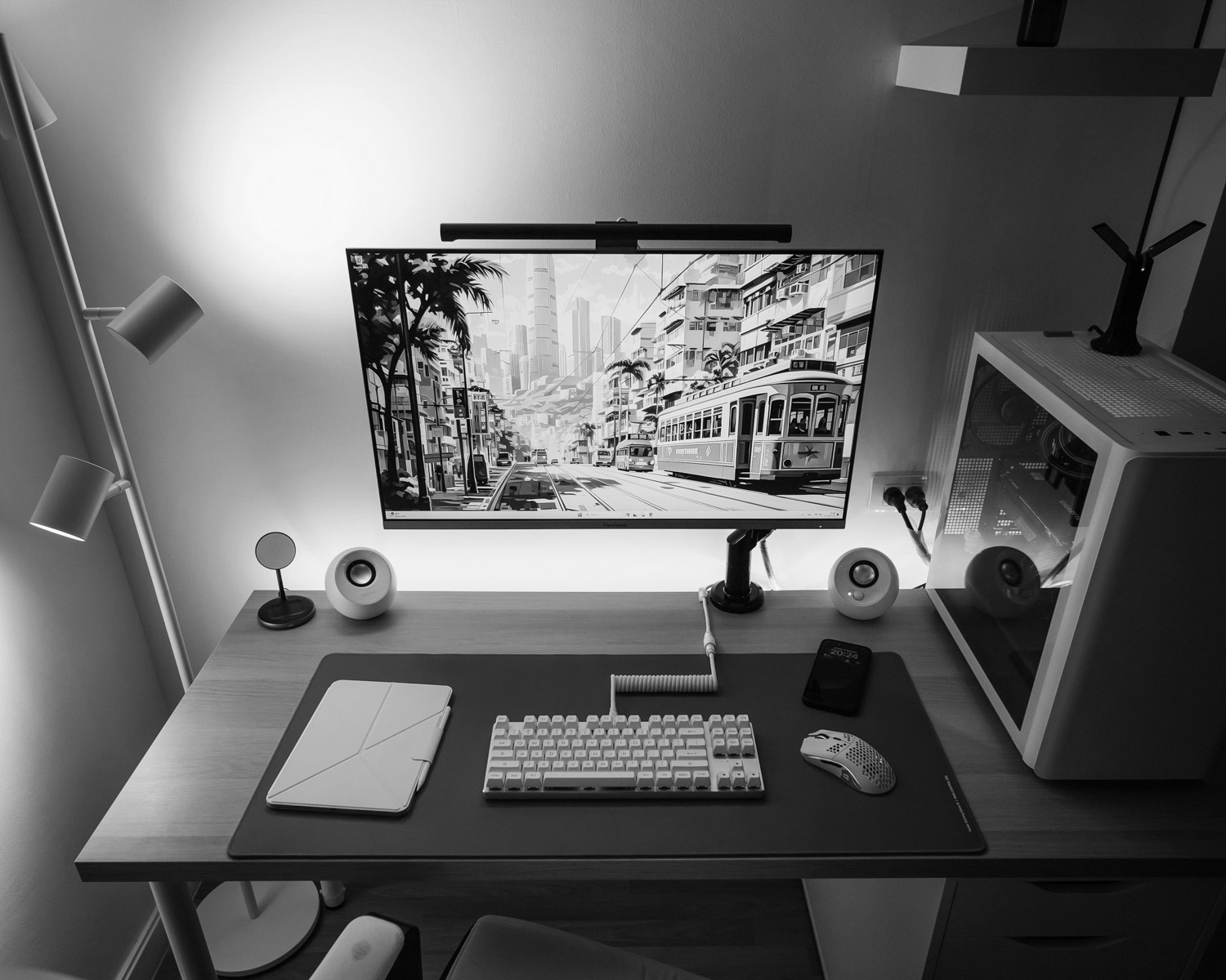 a computer desk with a keyboard, mouse and monitor