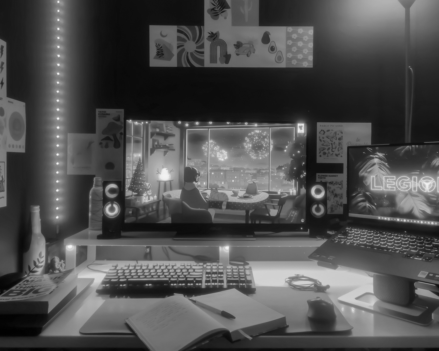 a desk with a laptop and a monitor on it