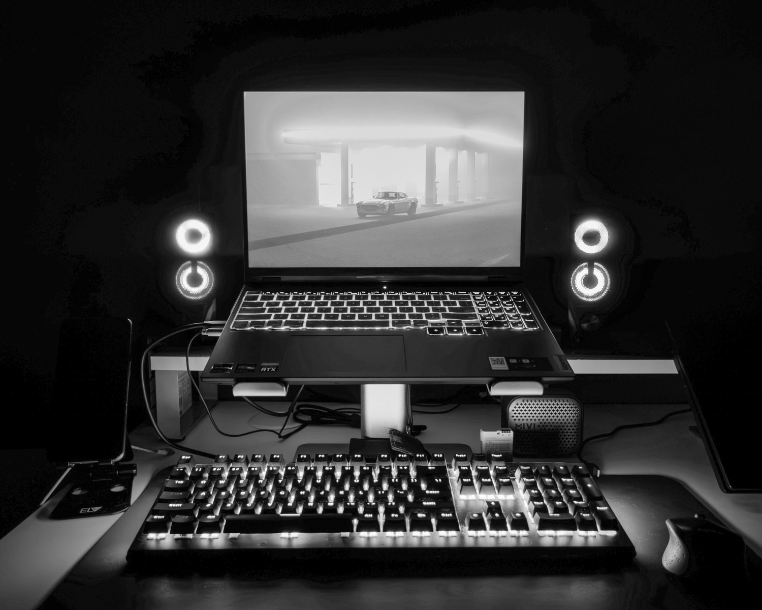 a laptop computer sitting on top of a desk