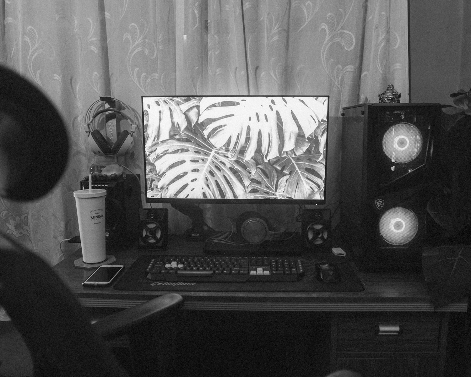 a person sitting in front of a computer