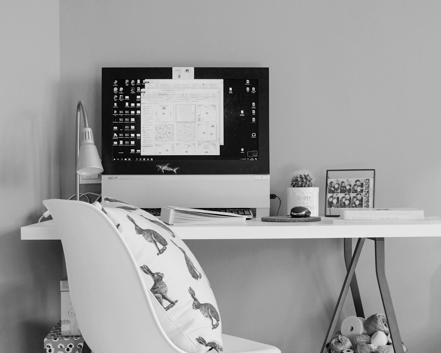 black flat screen computer monitor on white wooden table