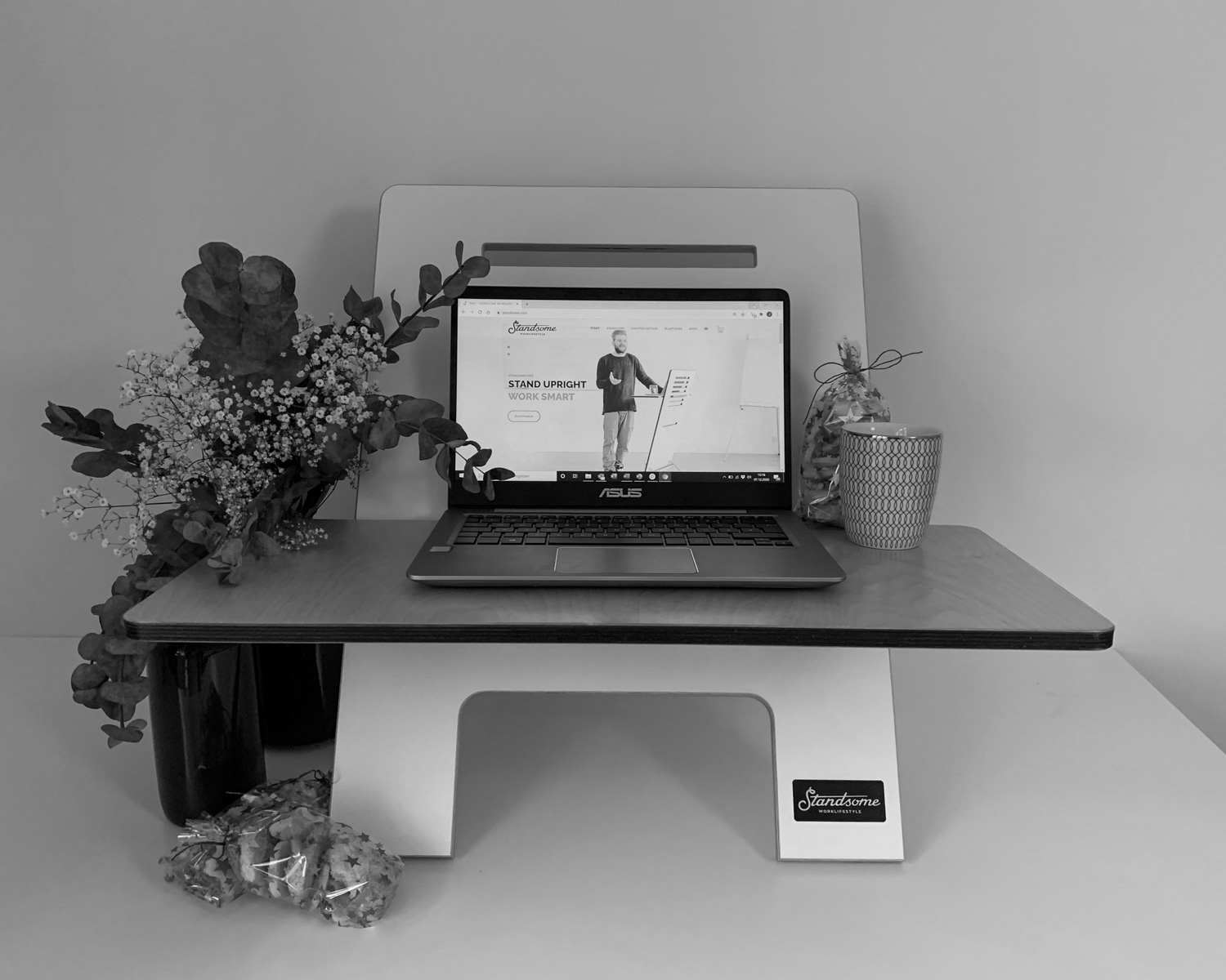 black laptop computer on white wooden desk