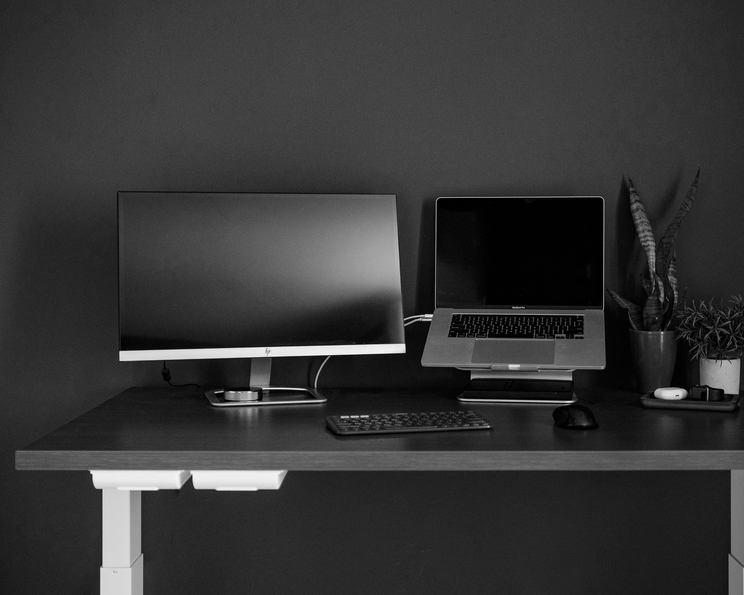 silver flat screen computer monitor on brown wooden desk