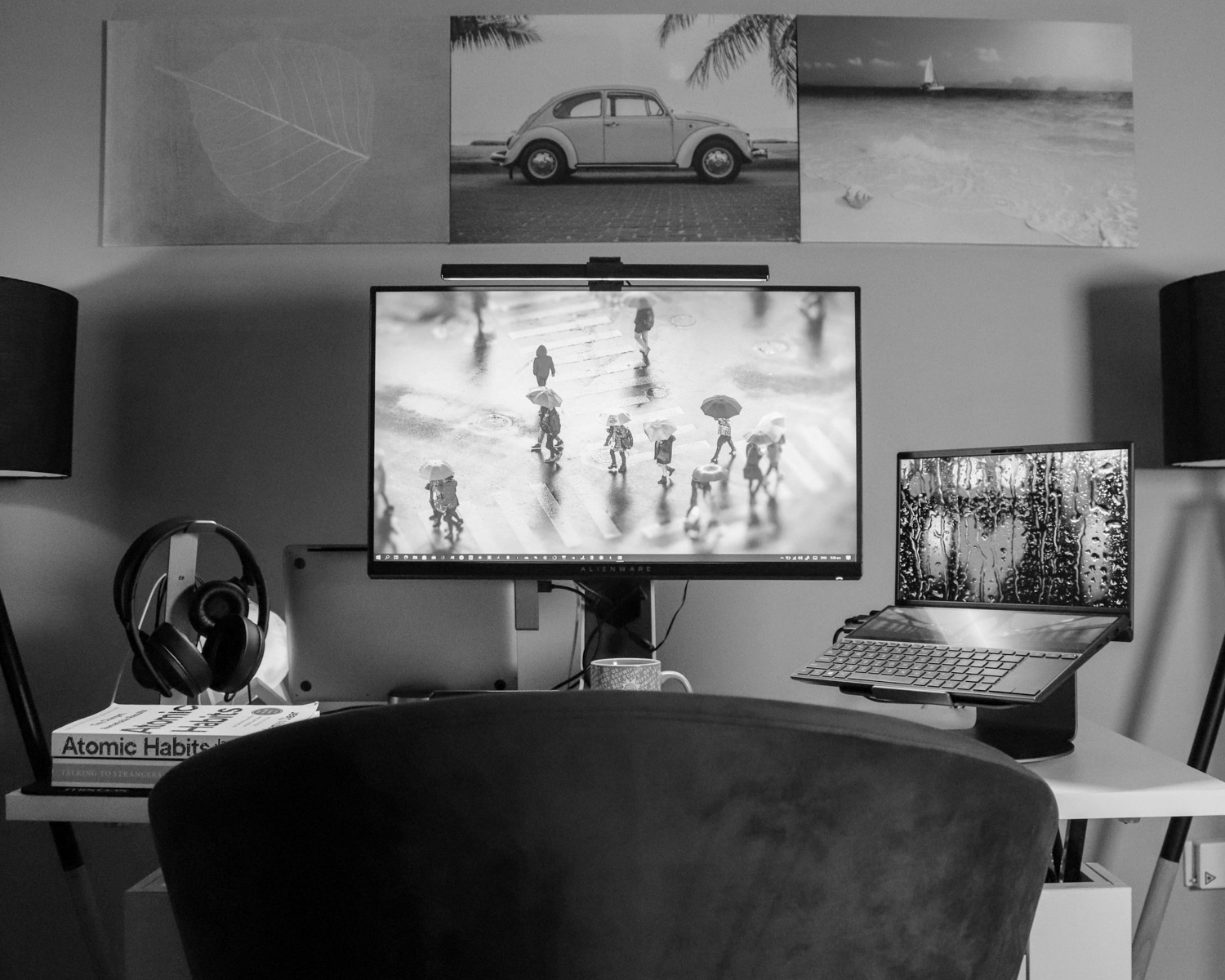 black flat screen tv turned on near black laptop computer