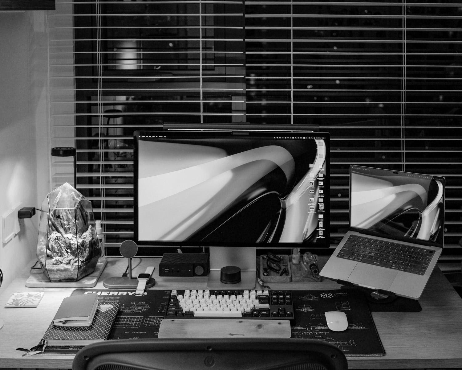 A cozy desk setup with computer equipment.