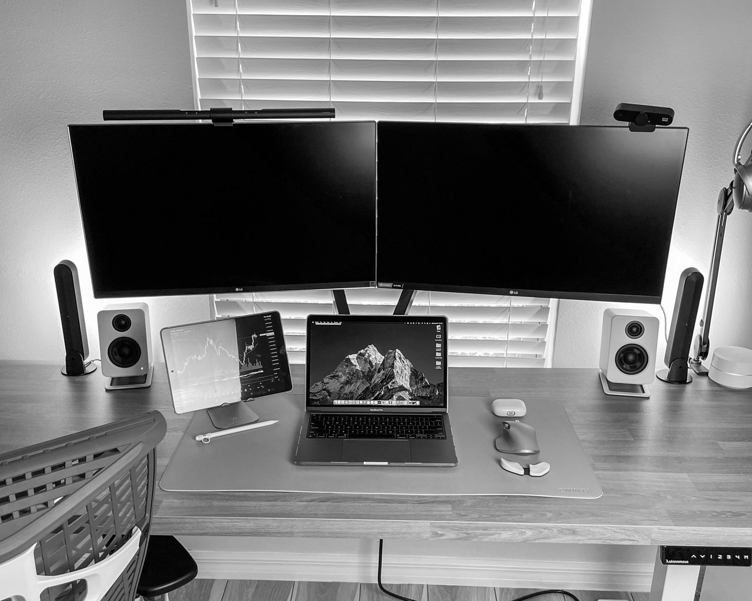 black ipad on brown wooden table