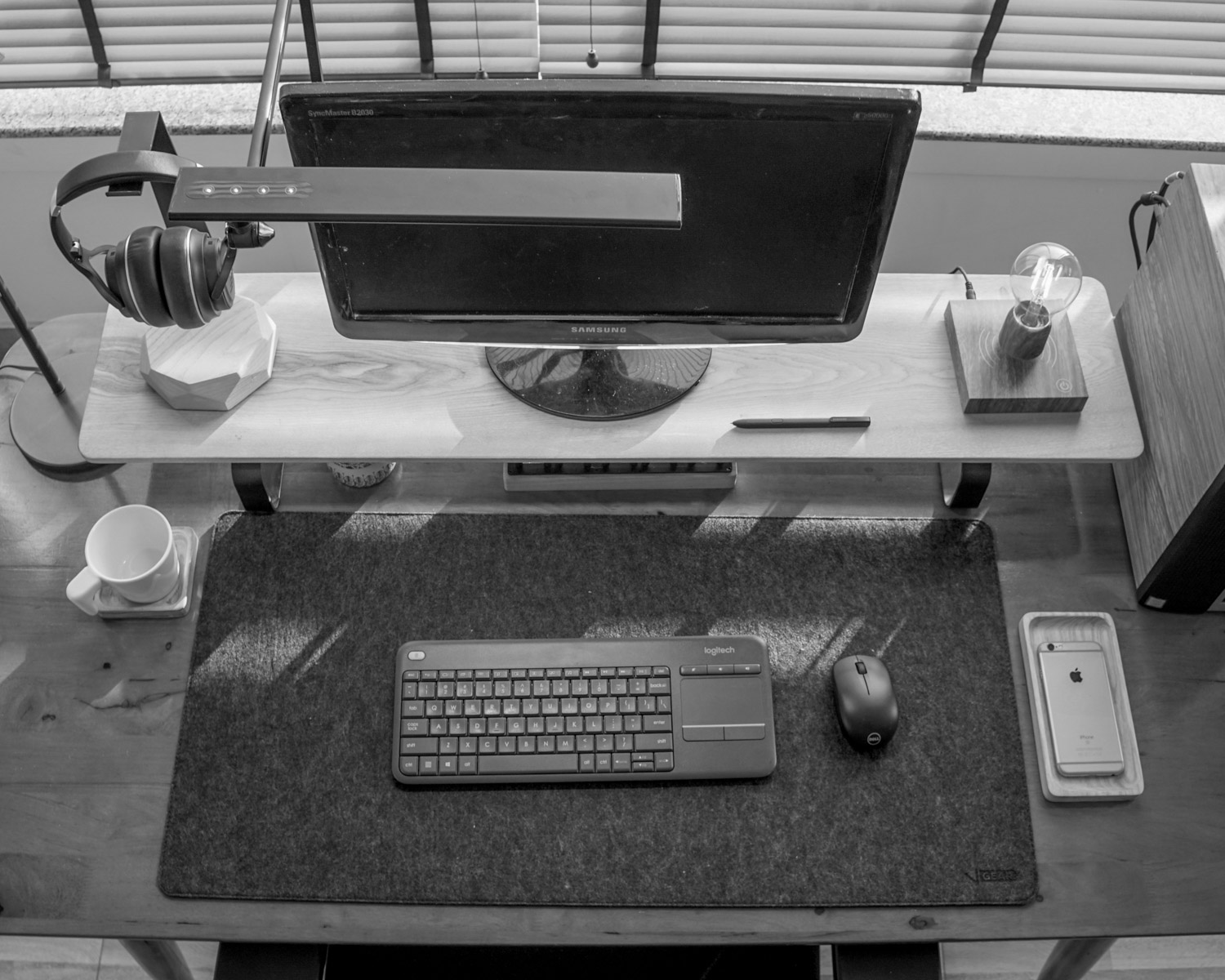 a computer desk with a keyboard and mouse