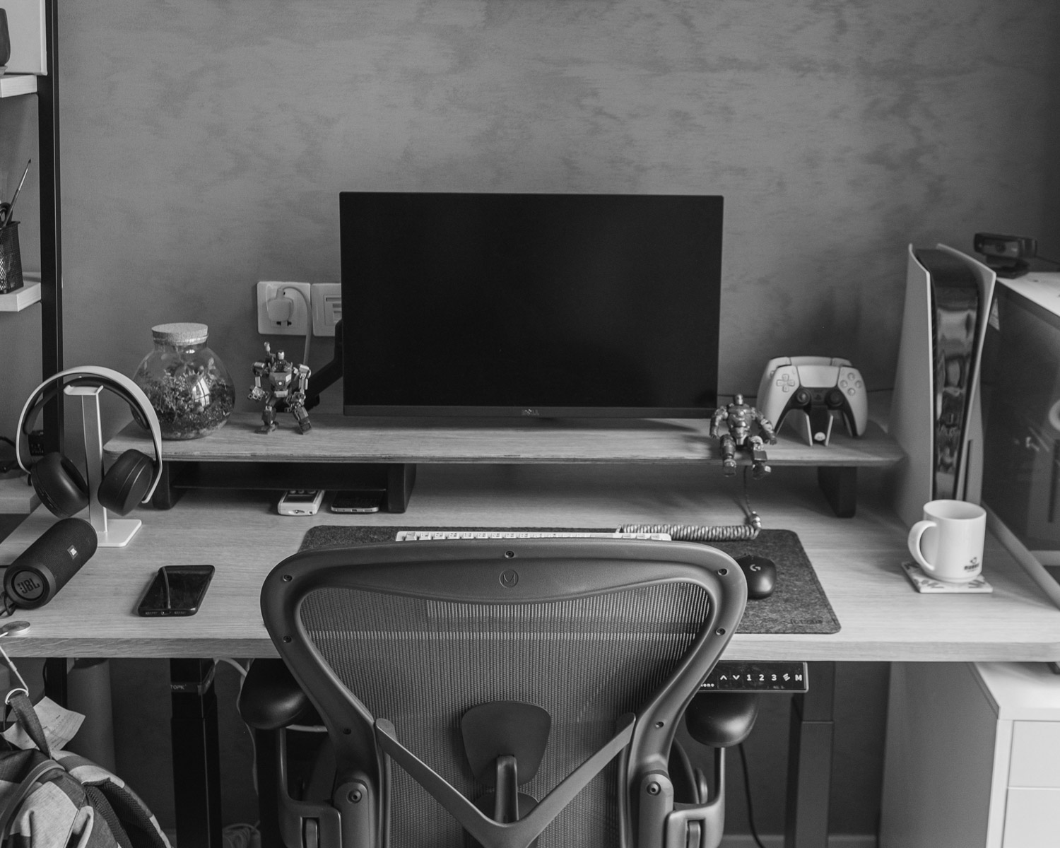 a desk with a computer and a printer on it