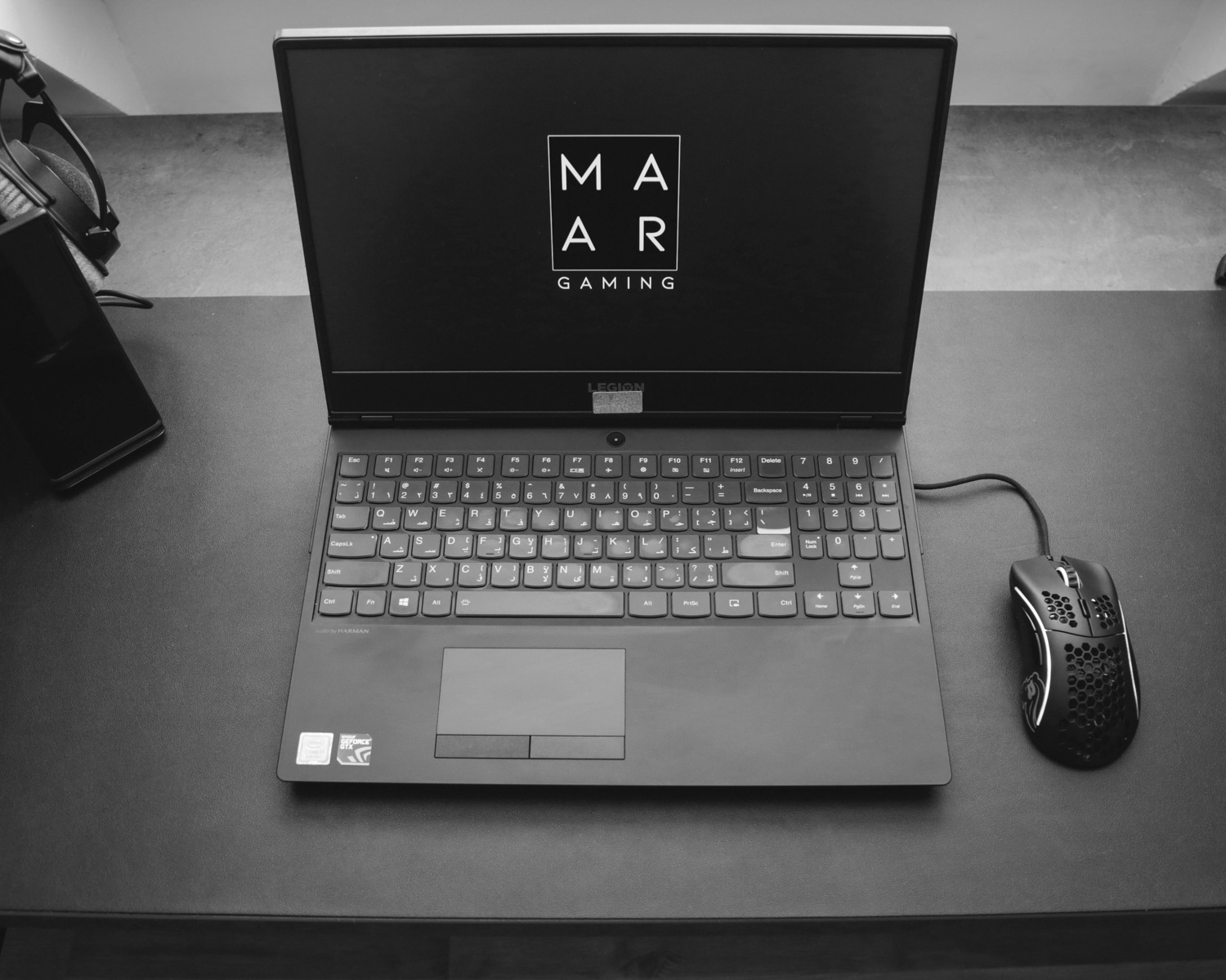 black asus laptop computer on black table
