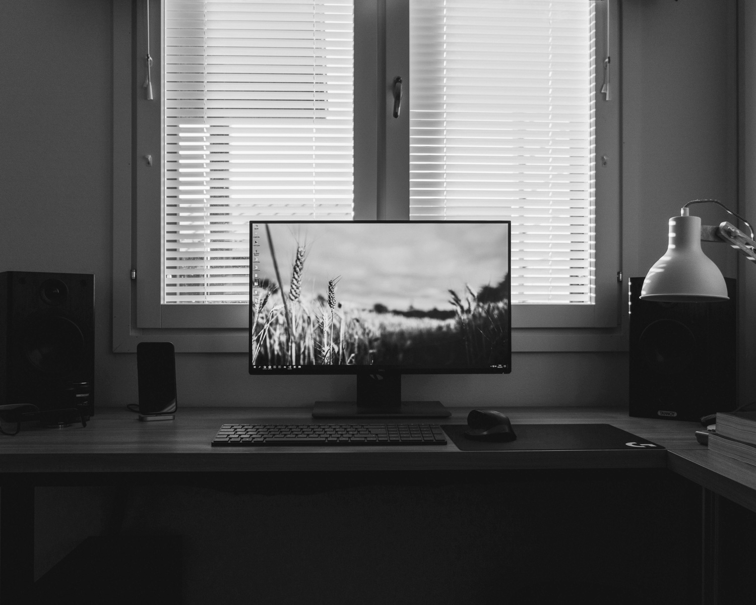 a desktop computer sitting on top of a wooden desk