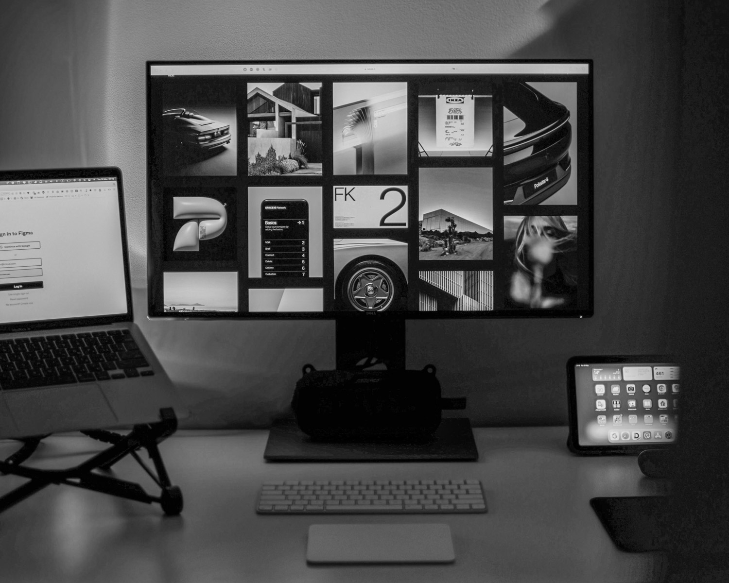 a desk with a laptop and a computer monitor