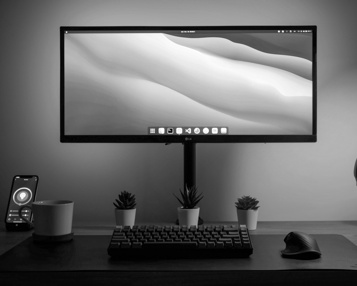 black flat screen computer monitor turned on beside black computer keyboard