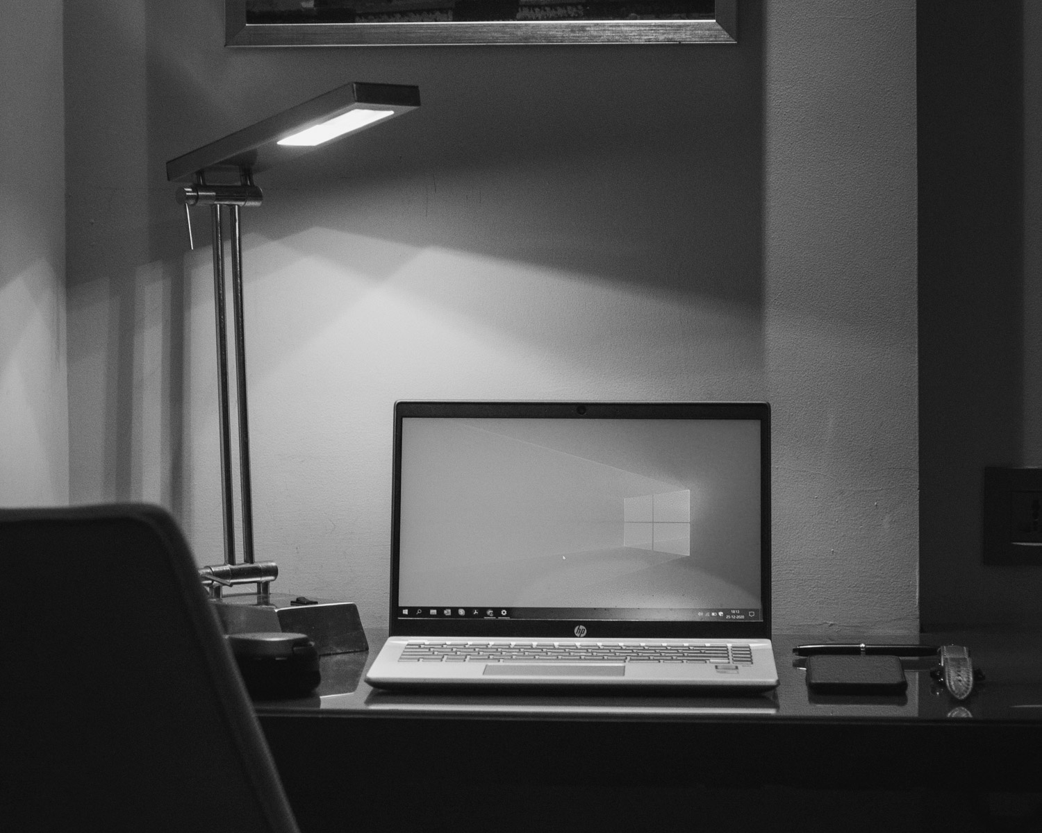 black and silver laptop computer on white table