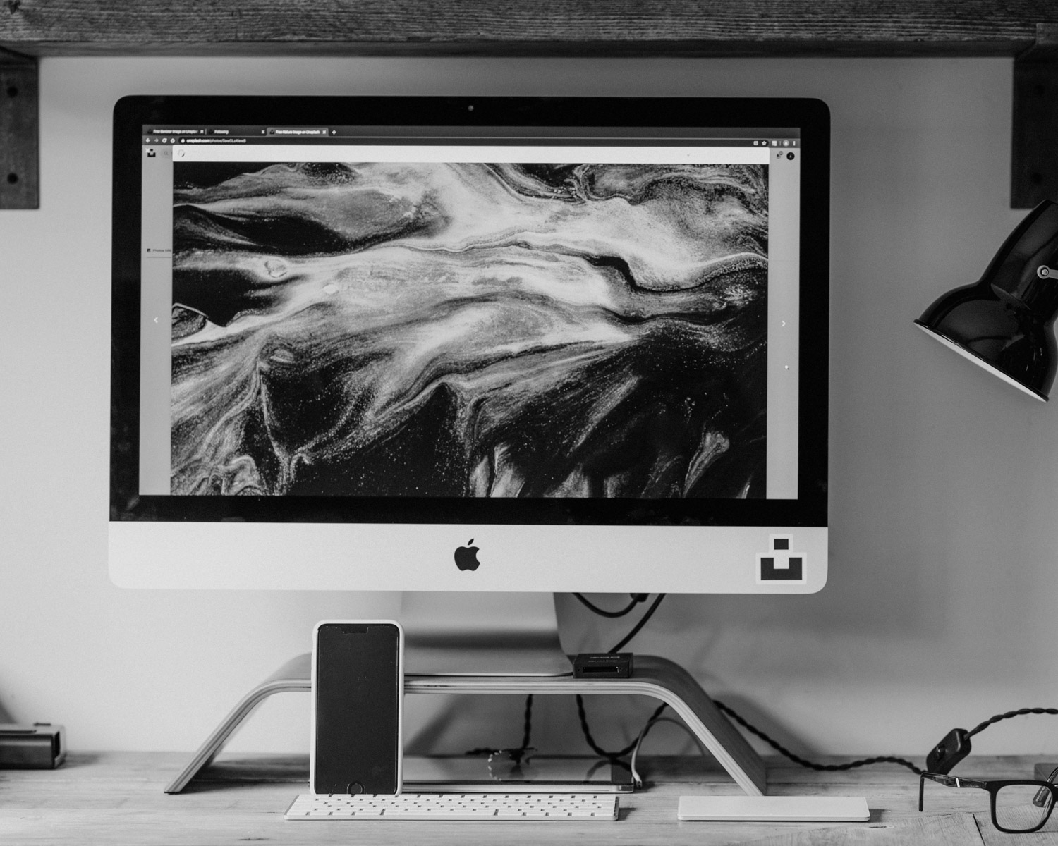 silver imac on white table