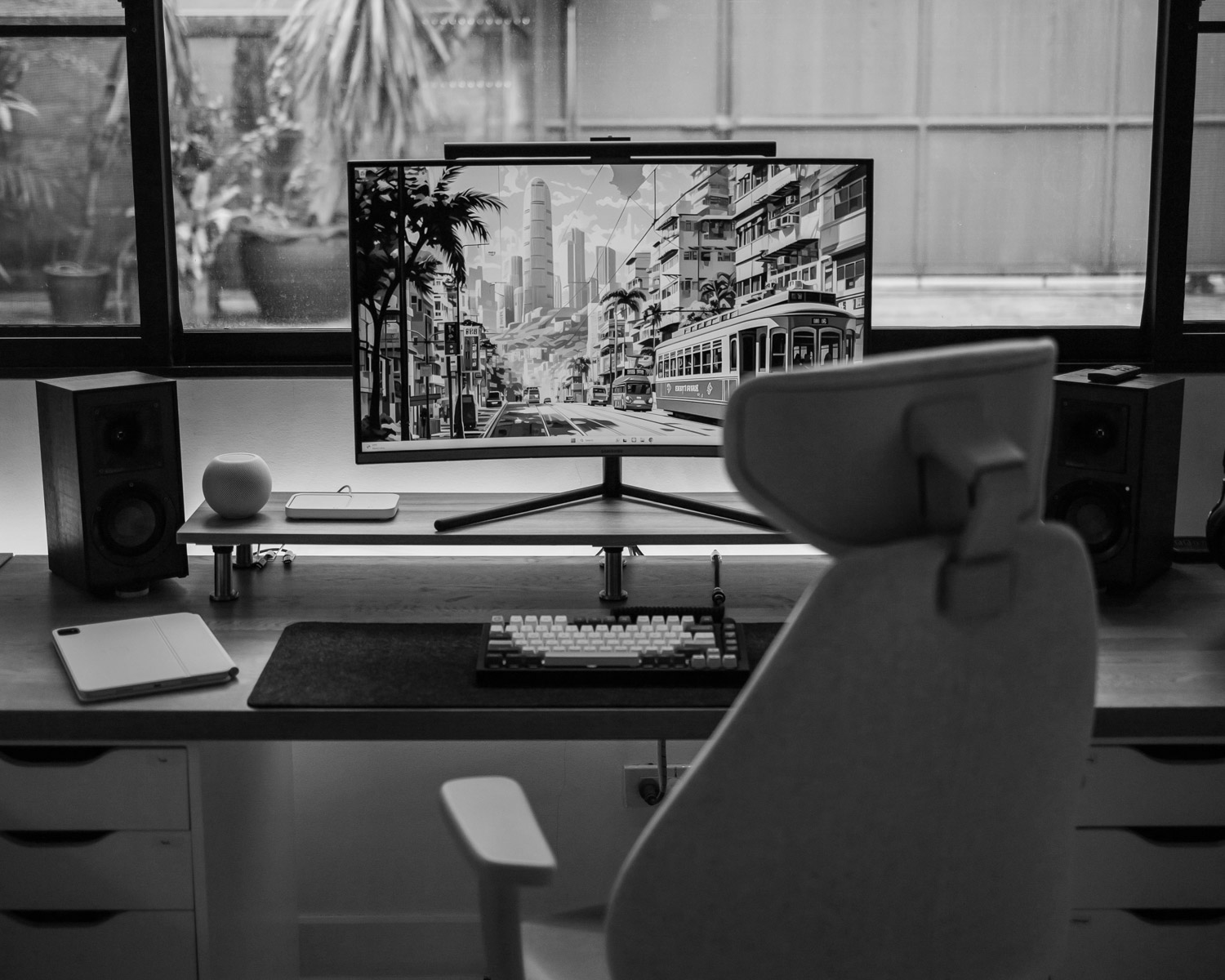 a computer monitor sitting on top of a wooden desk
