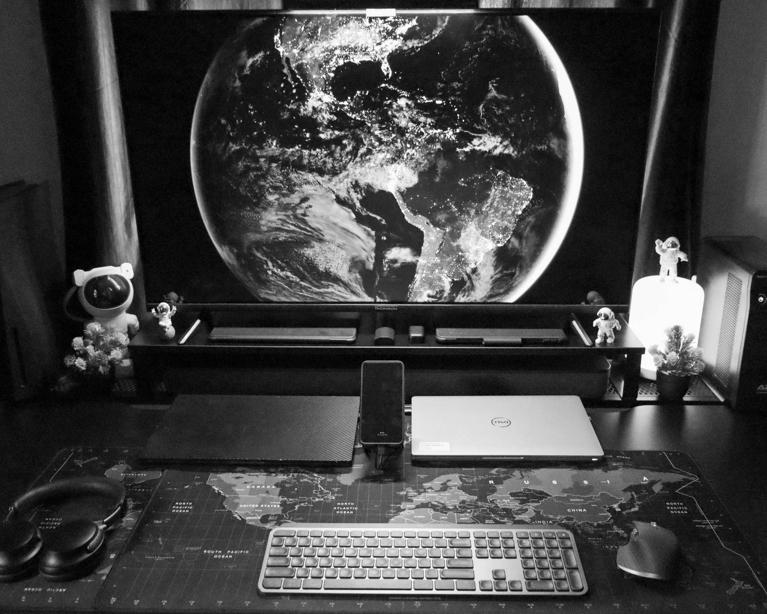 A computer desk with a monitor and keyboard