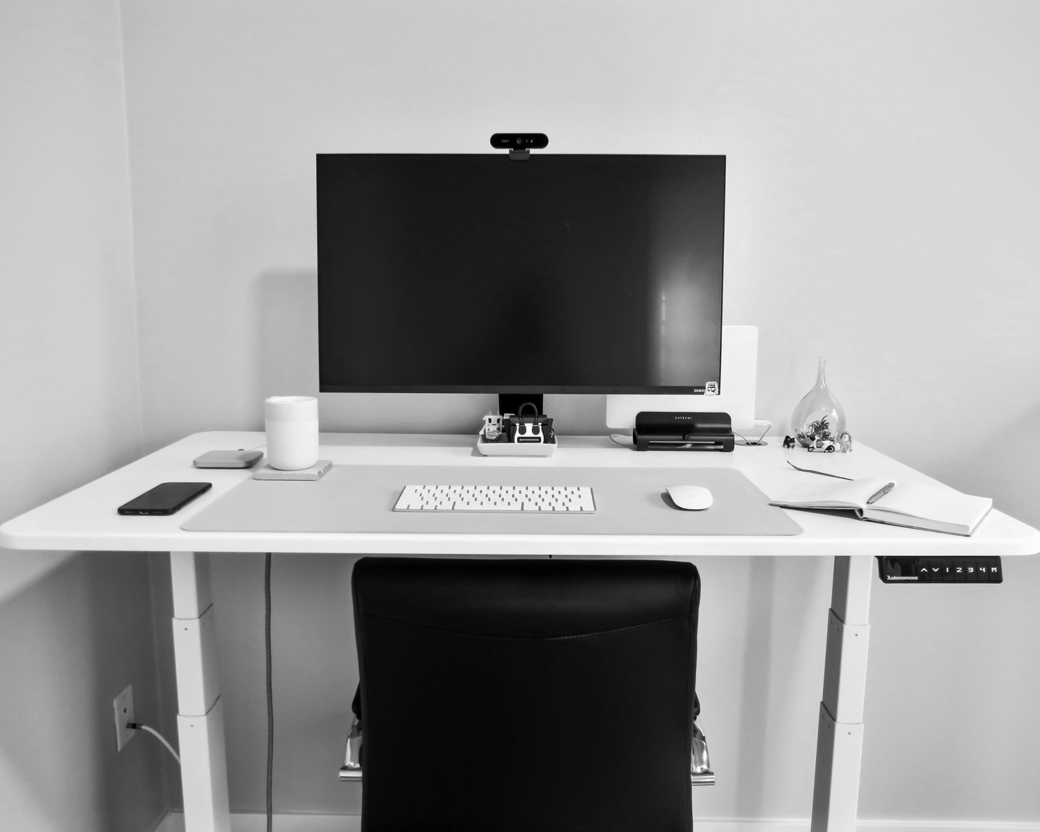 black flat screen tv on white and pink wooden table