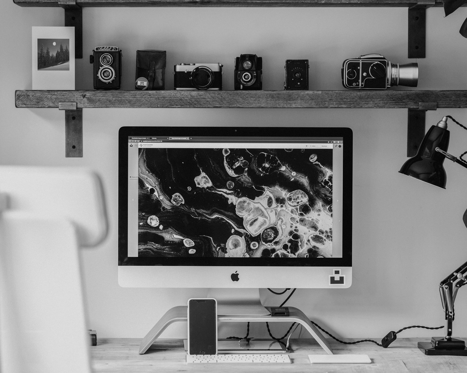 silver imac on brown wooden table