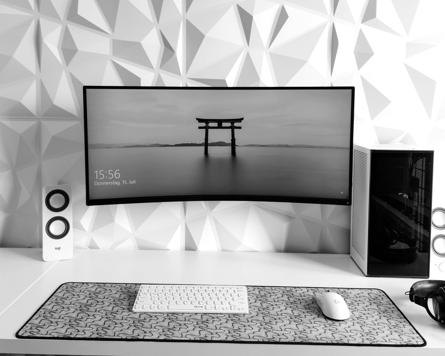 a computer monitor sitting on top of a desk