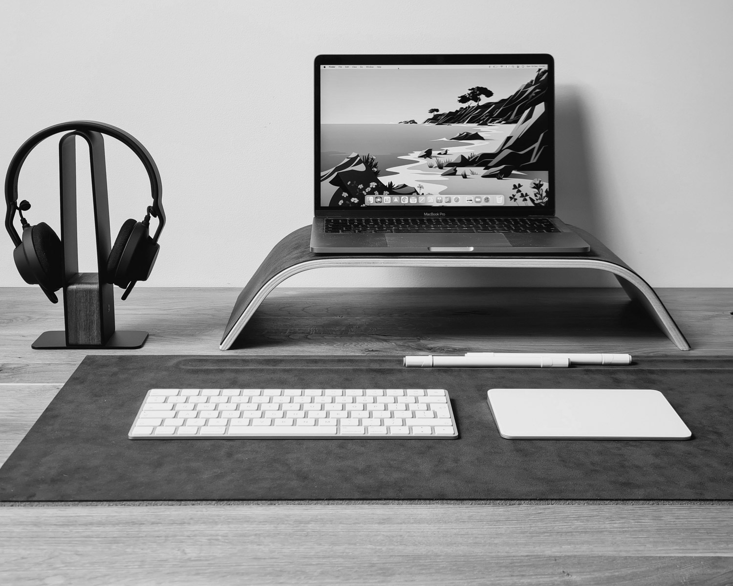 a laptop computer sitting on top of a wooden desk
