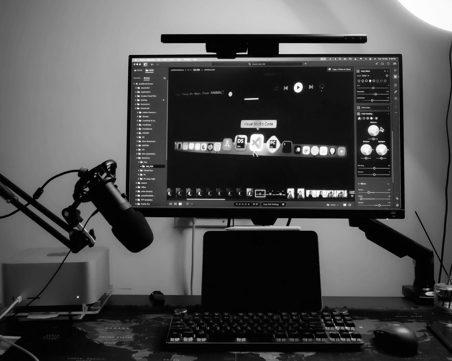 a computer monitor sitting on top of a desk