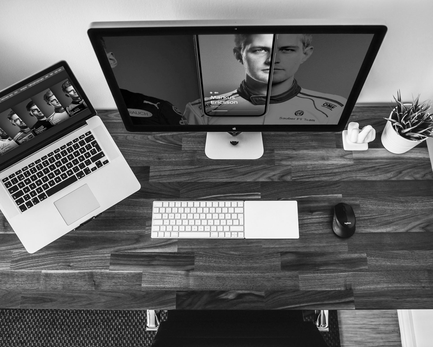 silver imac beside black corded computer mouse and white apple keyboard on brown wooden desk