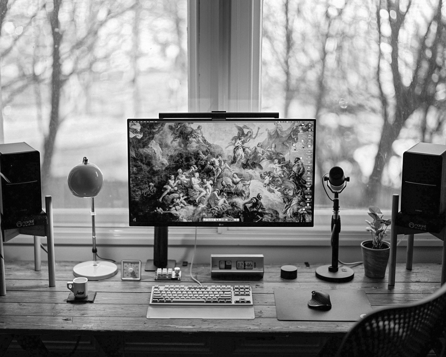 a computer monitor sitting on top of a wooden desk