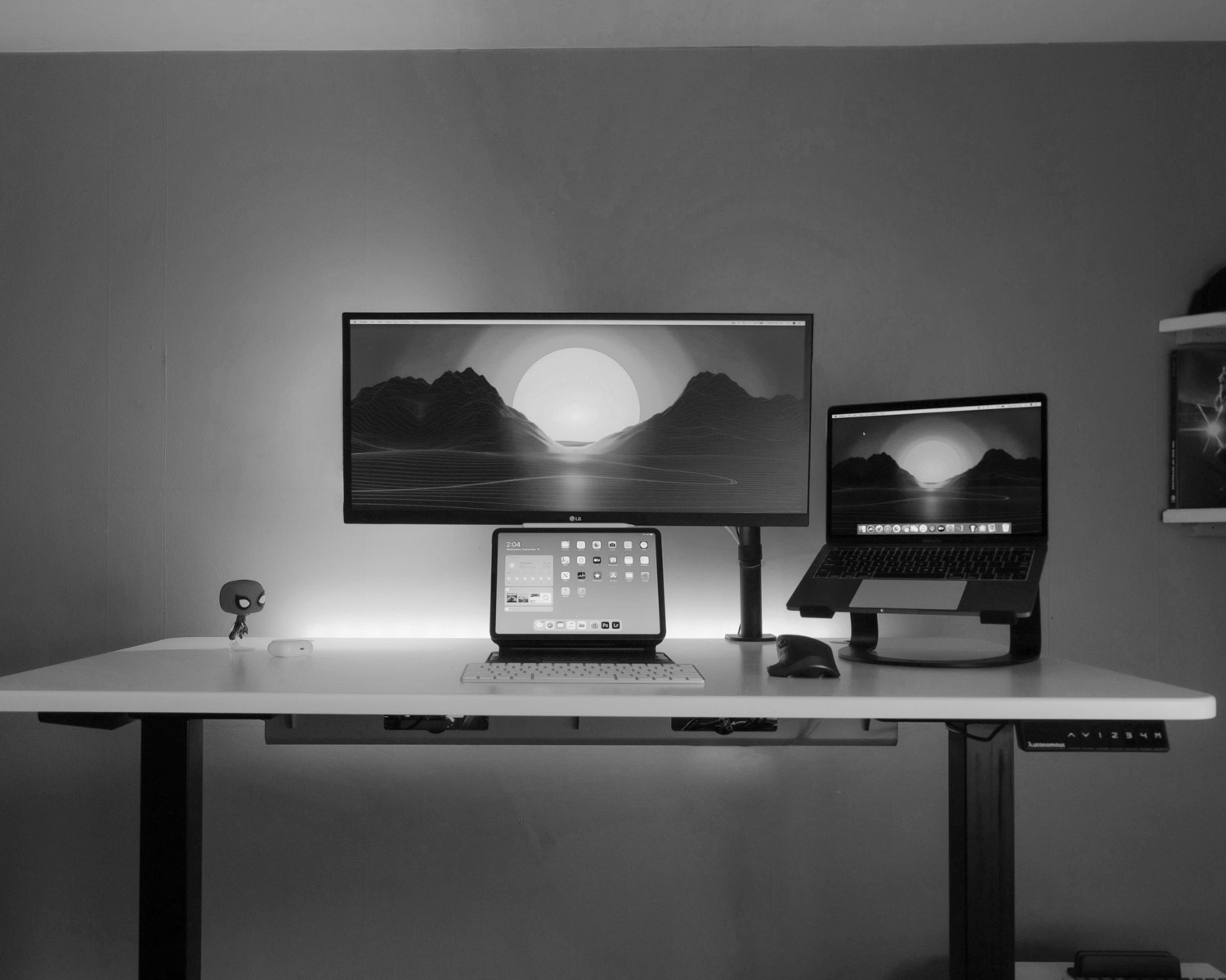 black flat screen computer monitor on brown wooden desk