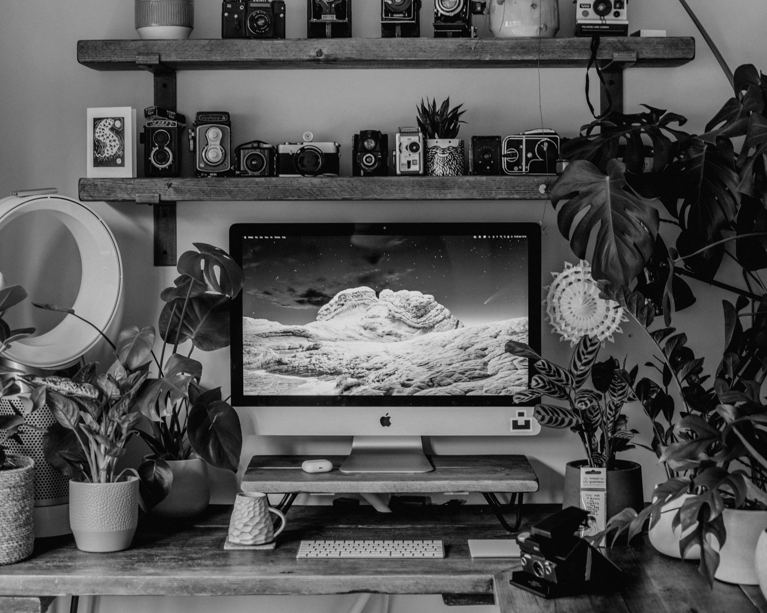 black flat screen tv on brown wooden wall mounted rack