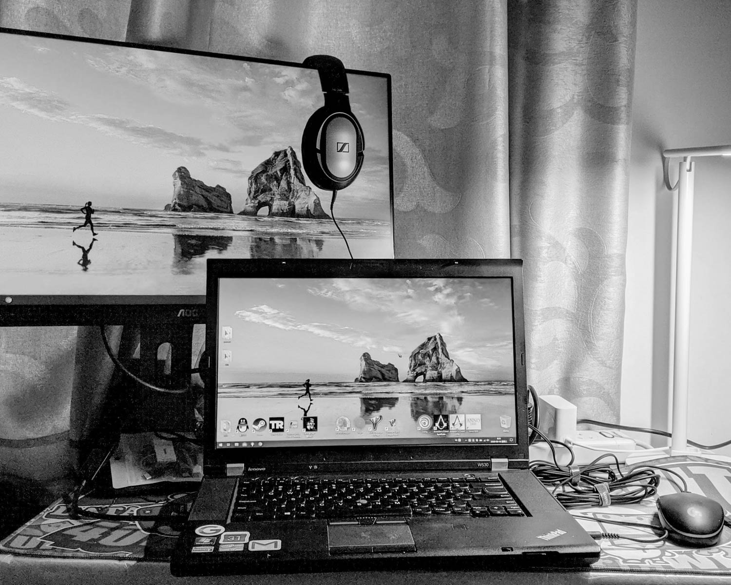 a laptop computer sitting on top of a desk