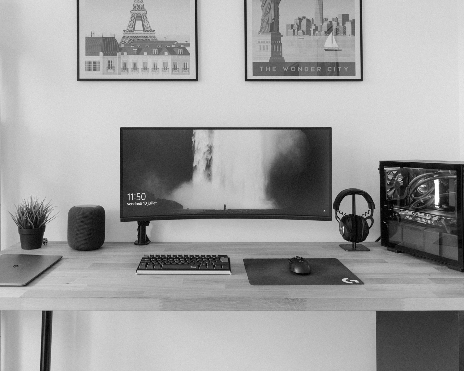black flat screen computer monitor on brown wooden desk