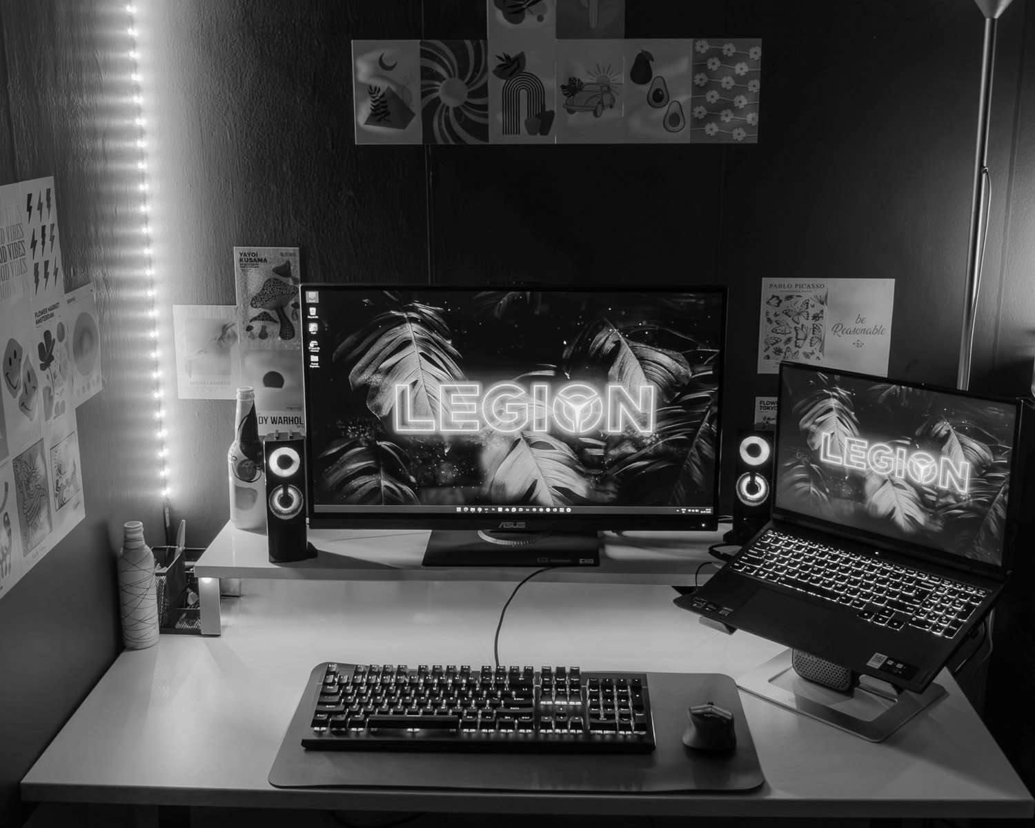 a desk with a laptop and a monitor on it