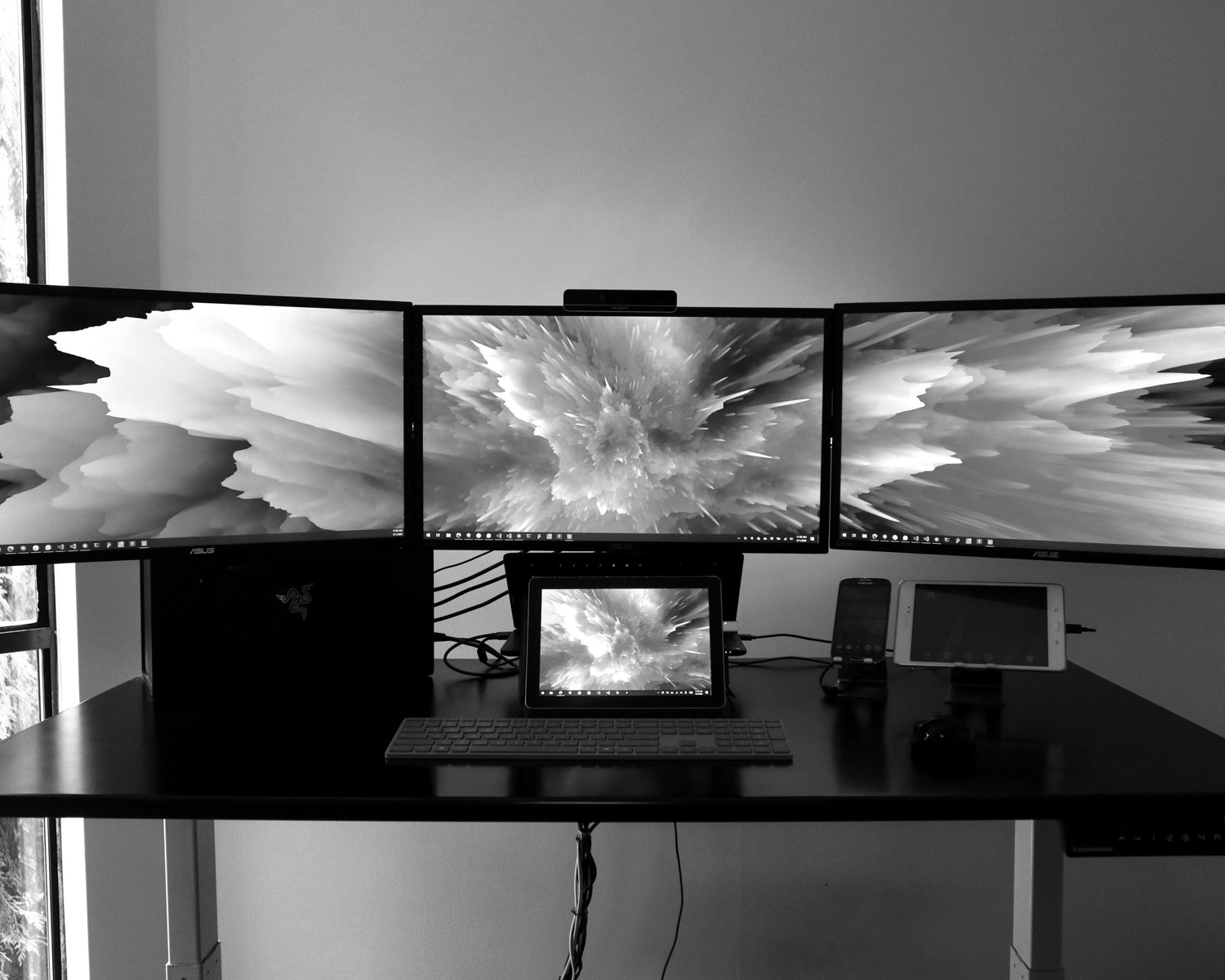 black flat screen tv on white wooden table