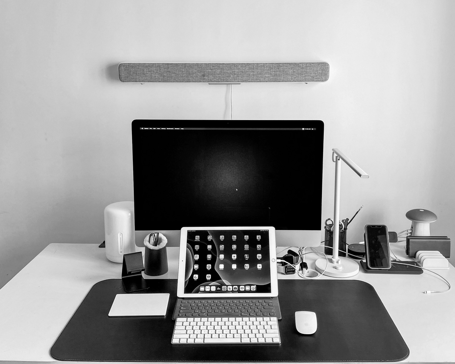 black flat screen computer monitor on white wooden desk