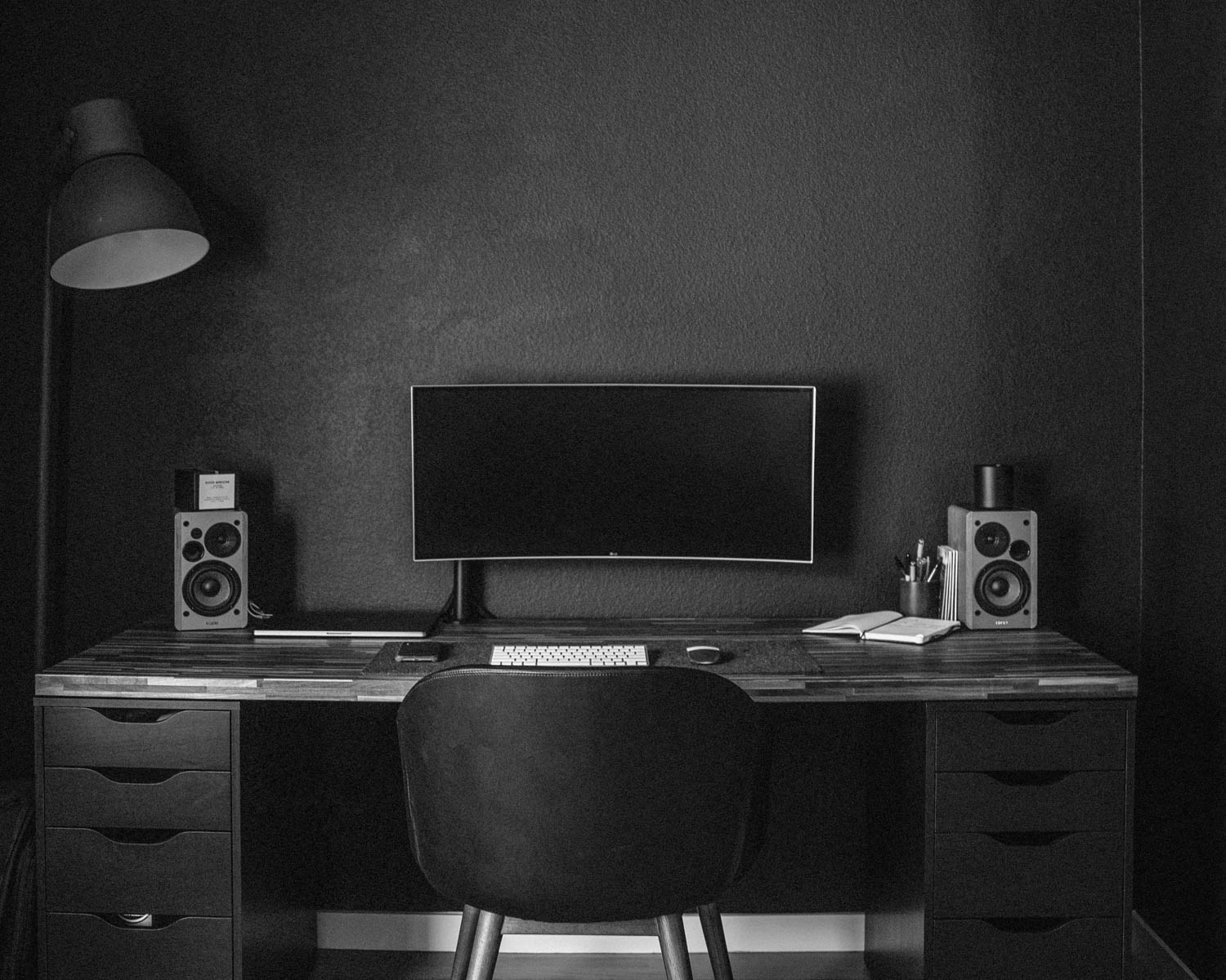 A desk with a computer on top of it