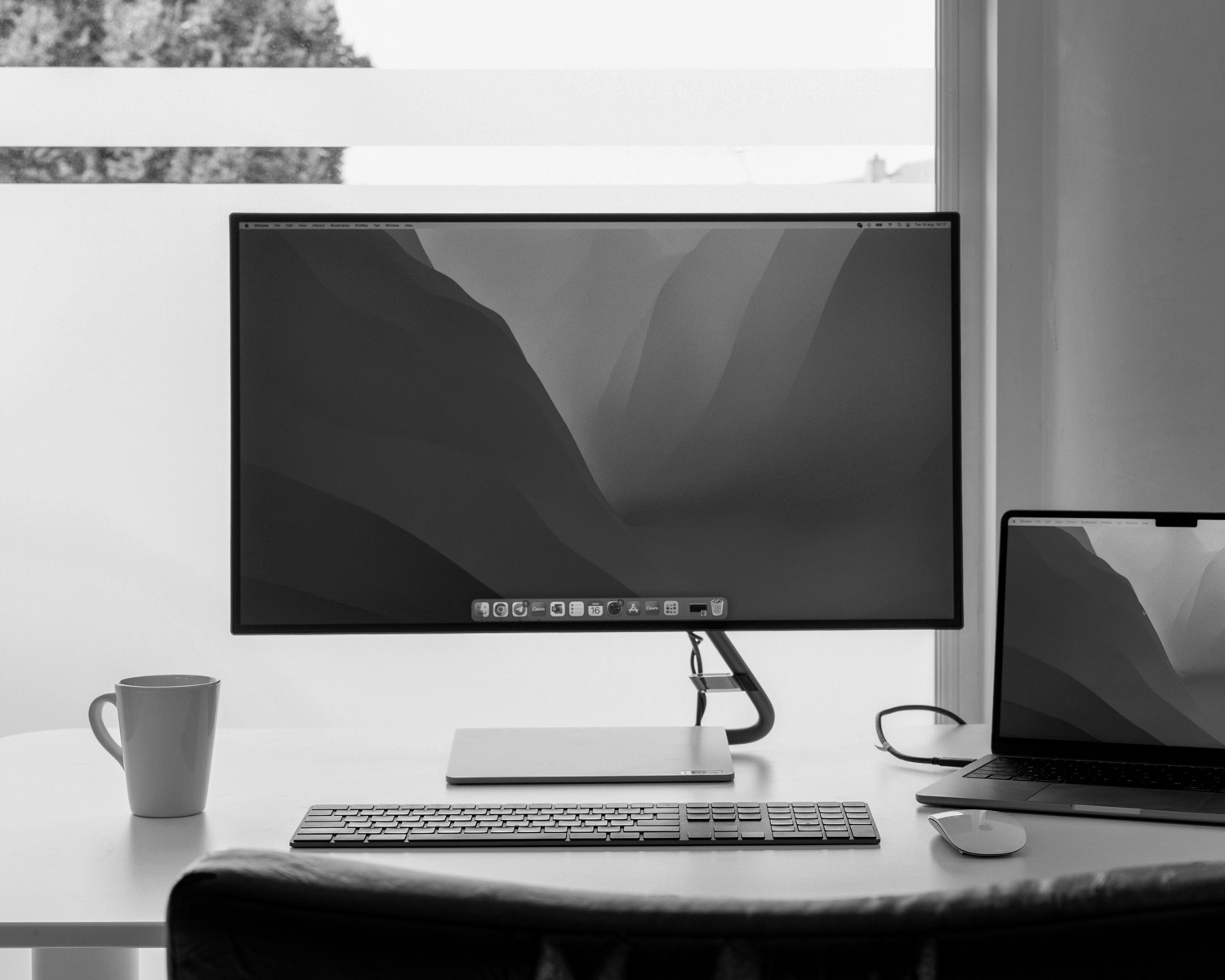 a computer monitor and keyboard on a desk