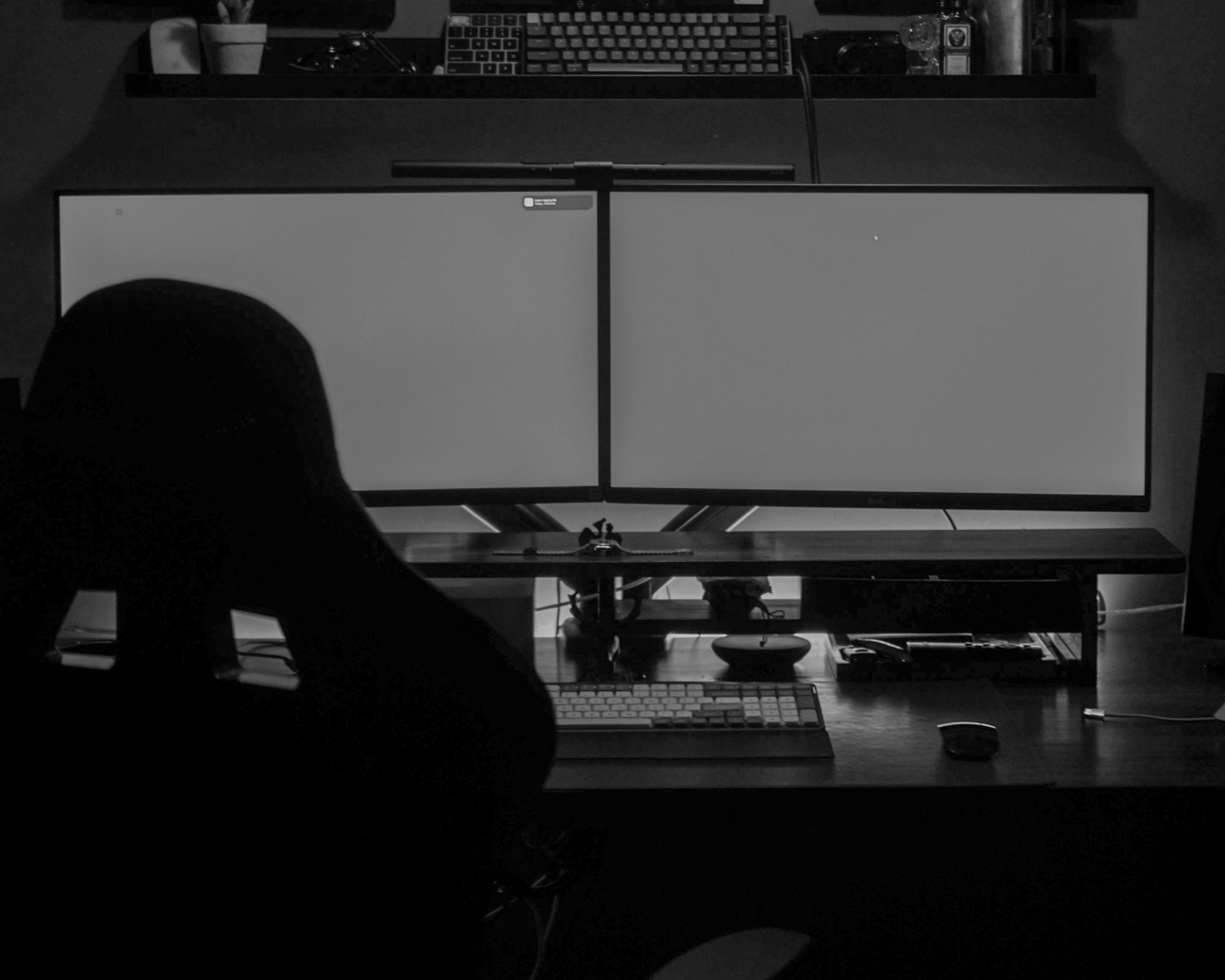A person sitting at a desk in front of a computer