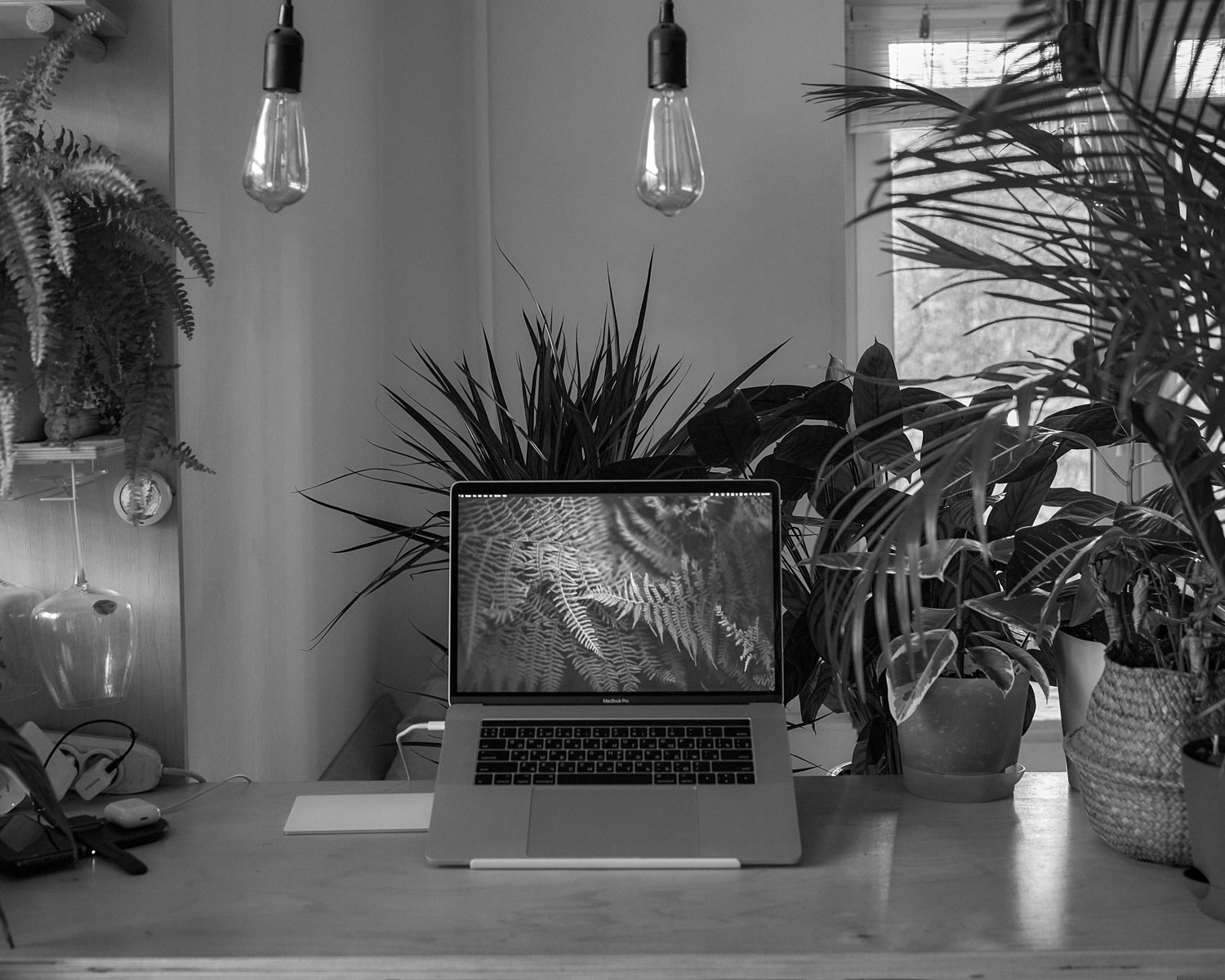 macbook pro on white table