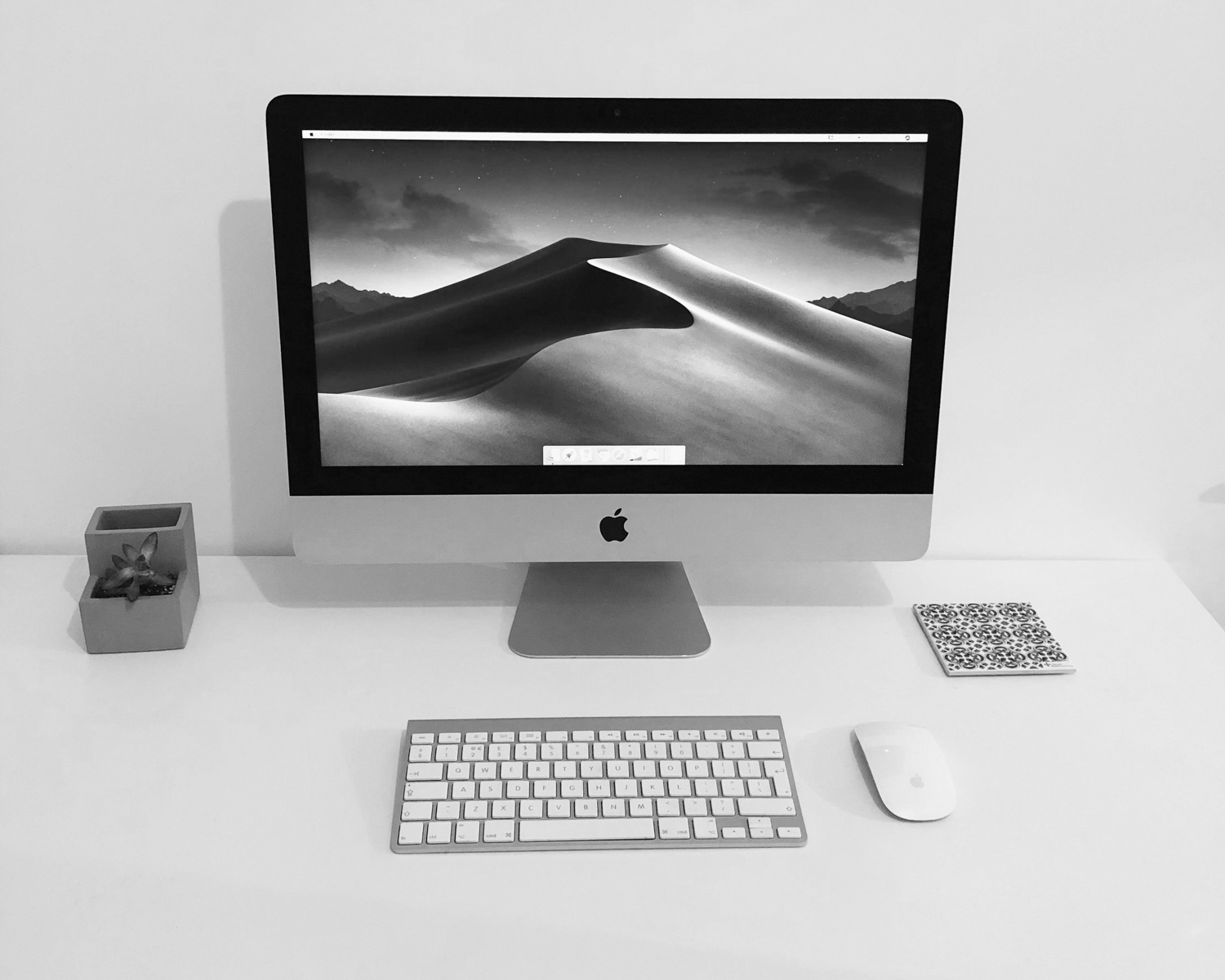 silver imac on white table