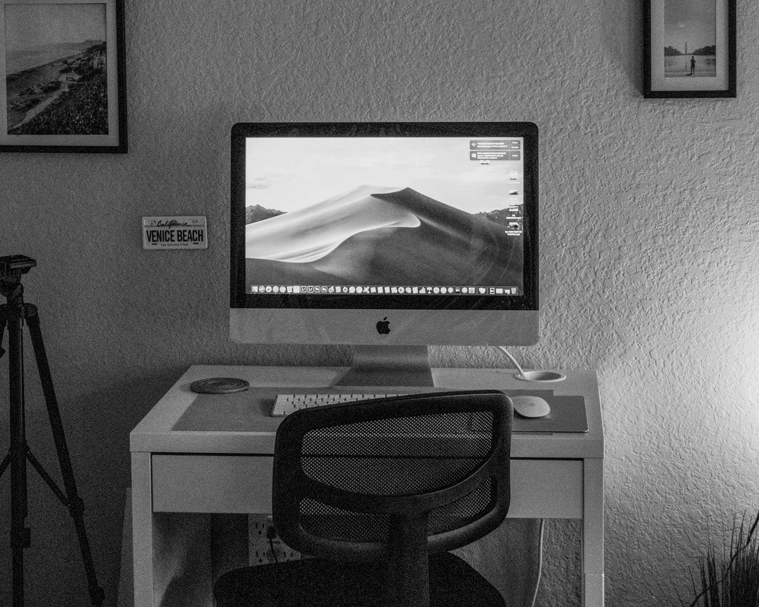 black flat screen tv turned on near white printer