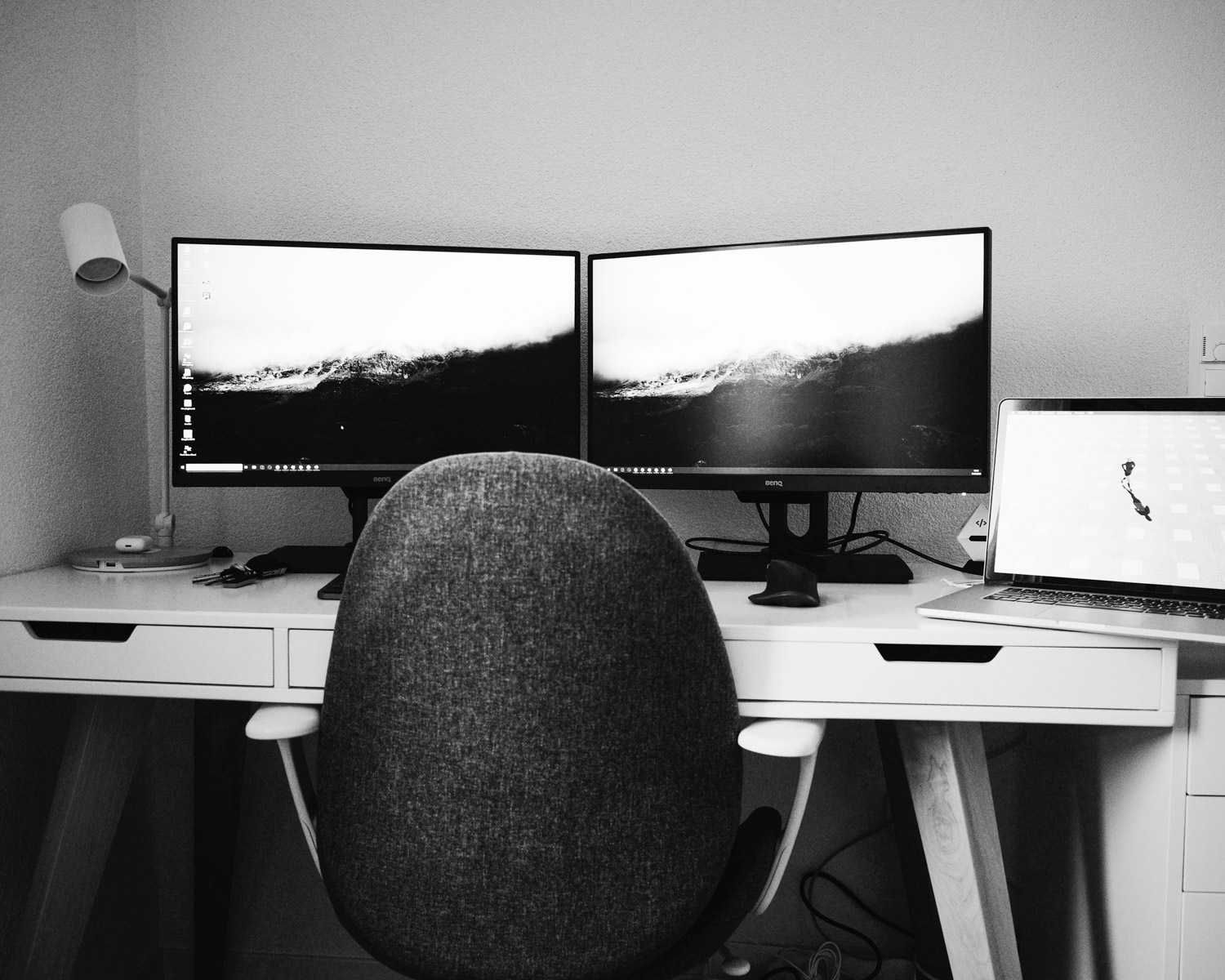 2 black flat screen computer monitor on white wooden desk