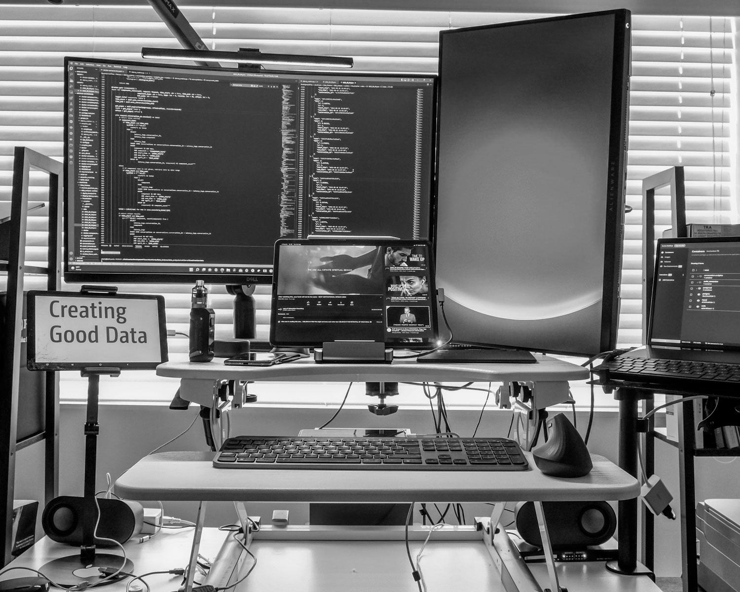 a desk with several computers