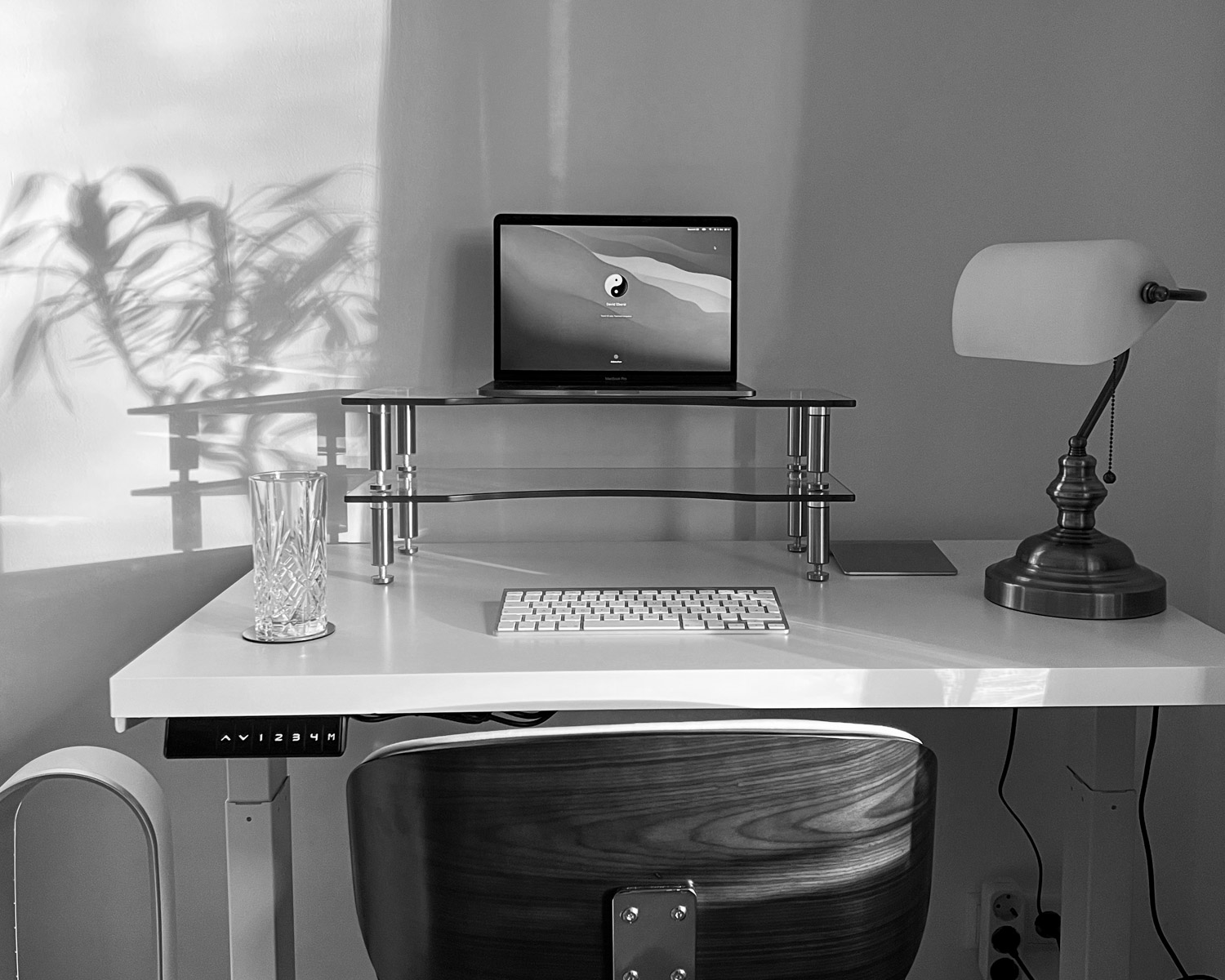 a desk with a computer and a chair