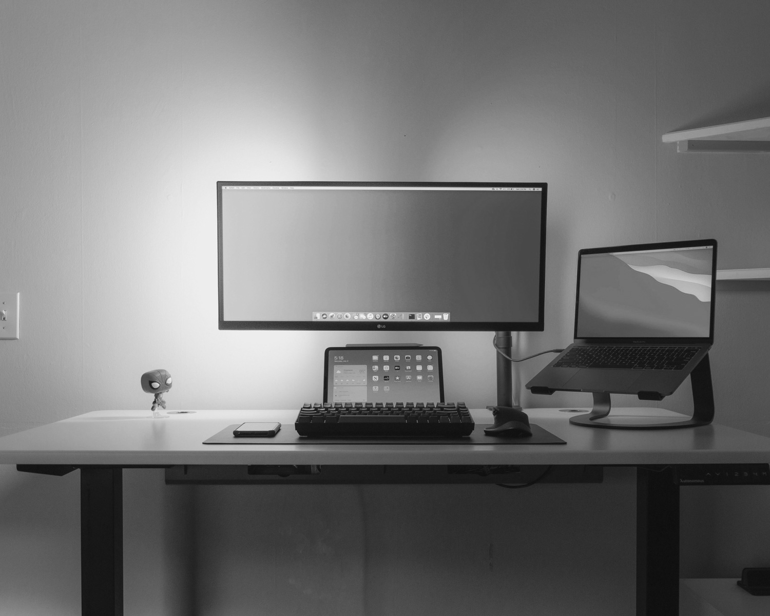 black flat screen computer monitor on white wooden desk