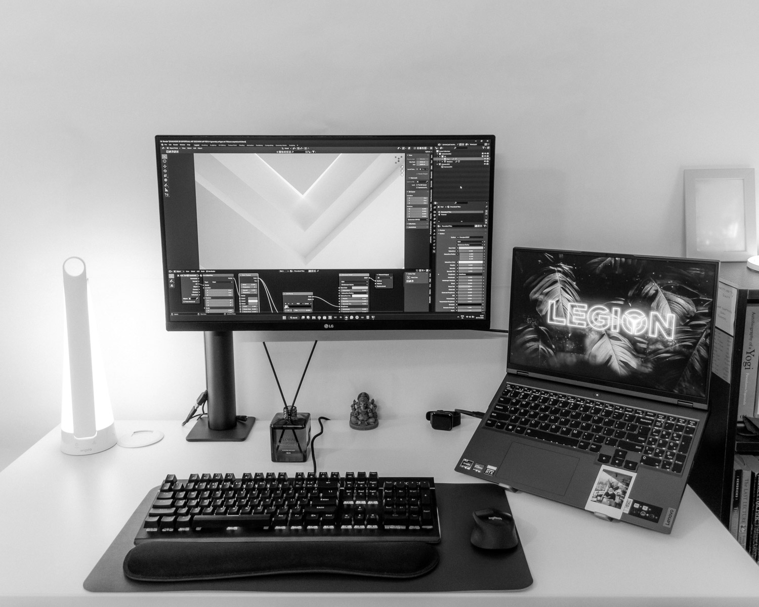 a desk with a laptop and a computer monitor