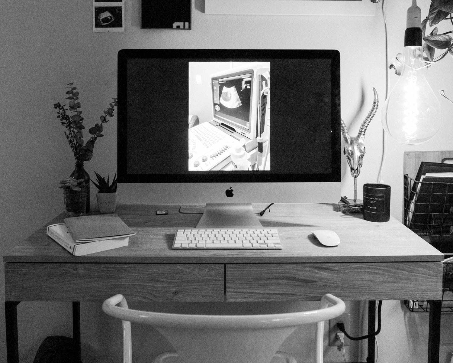 silver imac on brown wooden table