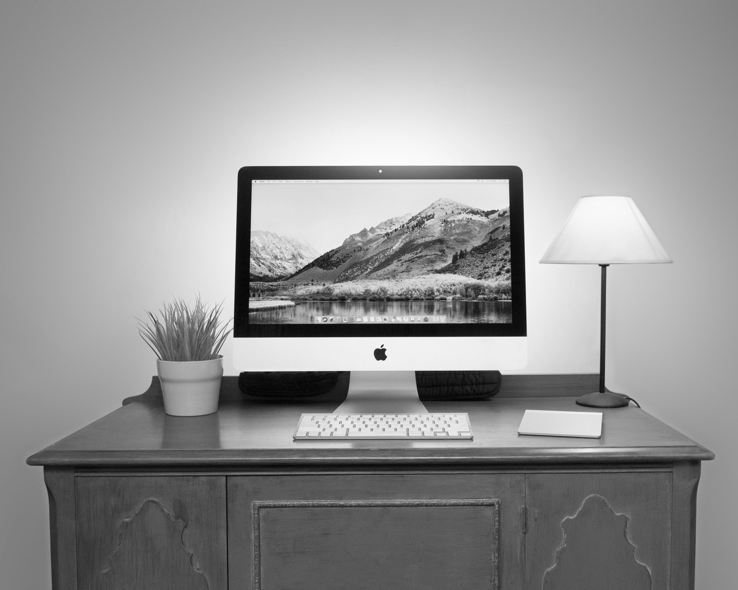 silver iMac and Apple Magic Keyboard on table
