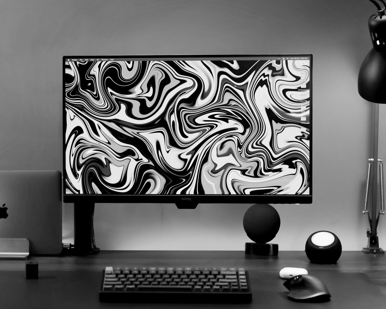 a desktop computer sitting on top of a wooden desk