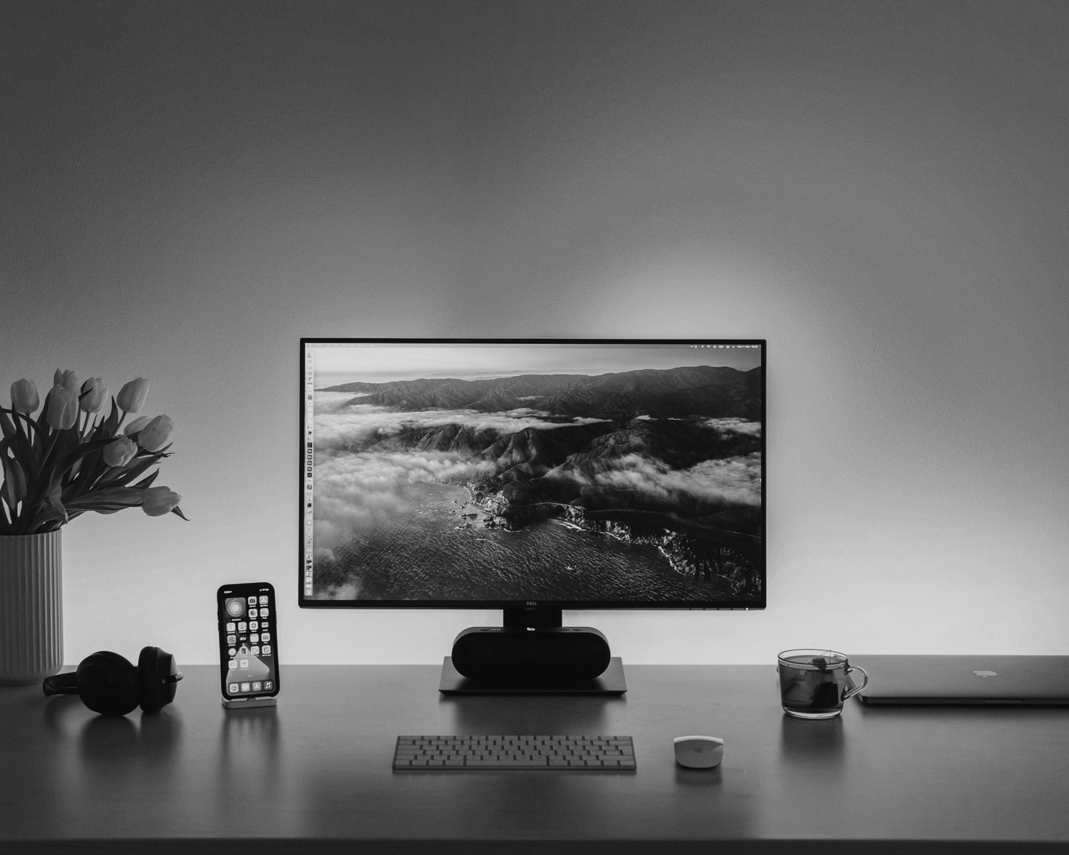 black flat screen computer monitor on brown wooden desk